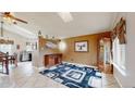 Inviting living room featuring tile floors, modern decor, and an open concept design at 10517 Clermont Way, Thornton, CO 80233