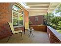 Cozy front porch with comfortable seating and brick details for relaxing outdoors at 1434 Clermont St, Denver, CO 80220