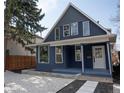 Charming two-story home with modern curb appeal, crisp white trim, and professionally landscaped front yard at 2831 N Perry St, Denver, CO 80212