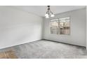 Neutral bedroom features large window letting in natural light at 8236 E Phillips Pl, Centennial, CO 80112
