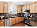 Spacious kitchen with stainless steel appliances and granite countertops at 10654 Ashfield St, Highlands Ranch, CO 80126