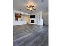 Spacious living room features hardwood floors, a fireplace, and an open layout ideal for entertaining at 15955 E Geddes Dr # 55, Aurora, CO 80016