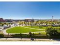 Aerial view of a lively city with a park, buildings, and stadium at 1401 Wewatta St # 714, Denver, CO 80202