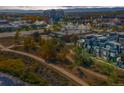 An aerial view showcases townhomes nestled in a vibrant community, offering convenient access to city amenities at 5036 S Platte River Pkwy, Littleton, CO 80123