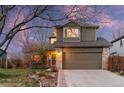 Charming two-story home with landscaped yard, brick accents, and attached two car garage at 12734 Eudora Dr, Thornton, CO 80241