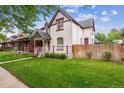 Charming home with a welcoming front porch and well-maintained lawn at 912 S Washington St, Denver, CO 80209
