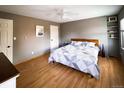 Comfortable main bedroom features a ceiling fan, ample natural light, and neutral decor at 30819 Hilltop Dr, Evergreen, CO 80439