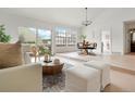 Open concept dining area with a wooden table and access to a patio at 1011 Pierce St # 5, Lakewood, CO 80214
