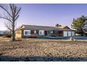 Exterior of single story home with three-car garage at 10353 N Chatfield Dr, Littleton, CO 80125