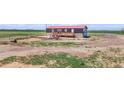 Aerial view of a quaint home featuring a front deck and sprawling, mostly barren land at 41575 E 88Th Ave, Bennett, CO 80102