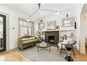 Cozy living room featuring a fireplace and vintage-inspired furniture at 2167 S Emerson St, Denver, CO 80210