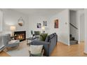 Bright living room featuring a cozy fireplace, modern furniture, and stylish decor for comfortable living at 1287 Benton St, Lakewood, CO 80214
