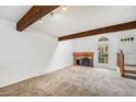 Cozy living room with a fireplace and natural light at 1915 S Hannibal St # G, Aurora, CO 80013