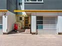 The property has a modern exterior featuring a garage and a red scooter parked in front at 3133 Blake St # 3, Denver, CO 80205