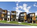 Street view of modern townhomes showcasing contemporary design and curb appeal at 1260 N Stuart St # 2, Denver, CO 80204