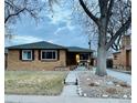 Ranch home with landscaping and a large tree in the front yard at 3126 S Franklin St, Englewood, CO 80113