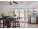 Eat-in kitchen features a dining area with access to the backyard patio at 1177 S Troy St, Aurora, CO 80012