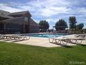 Relaxing pool area with plenty of lounge chairs for residents at 804 Summer Hawk Dr # 6105, Longmont, CO 80504
