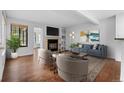 Bright living room with fireplace, built-in shelves, and modern furniture at 980 S Dahlia St # A, Denver, CO 80246