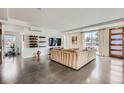 Bright living room featuring polished concrete floors and plenty of natural light at 4795 Highline Pl, Denver, CO 80222