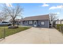 Cozy single-story house with a long driveway and tidy front lawn at 4849 N Cook St, Denver, CO 80216