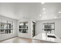 Bright, open kitchen featuring a large island, modern finishes, recessed lighting and lots of natural light at 2042 S Holly St # 3, Denver, CO 80222