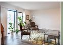 Bright living room with large windows, stylish decor, and access to outdoor balcony at 14091 E Marina Dr # 612, Aurora, CO 80014