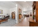 Entryway with wood floors, showing a sitting area and access to other rooms at 39260 Braxton Ln, Elizabeth, CO 80107