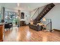 Inviting living room with hardwood floors, natural light, and comfortable seating at 4273 W Ponds Cir, Littleton, CO 80123