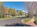 A scenic street view showcases the charming homes and tree-lined street in the neighborhood at 2831 Spruce St, Denver, CO 80238