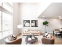 Inviting living room with a large window, comfortable seating, and a modern rug at 1555 W 43Rd Ave, Denver, CO 80211