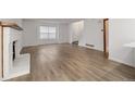 Spacious living room with light-colored floors and a cozy fireplace at 1770 S Quintero Way, Aurora, CO 80017