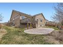 Expansive backyard with a concrete patio and deck, providing ample space for outdoor enjoyment at 6302 E 135Th Ave, Thornton, CO 80602