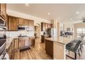 Modern kitchen with granite countertops, stainless steel appliances, and ample cabinet space at 6302 E 135Th Ave, Thornton, CO 80602