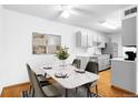 Dining area with a marble-top table, seating for four, and stainless steel appliances at 16359 W 10Th Ave # X6, Golden, CO 80401