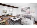 Open-concept living room and dining area with hardwood floors and neutral decor at 16359 W 10Th Ave # X6, Golden, CO 80401