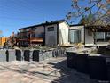 Spacious backyard, with a stone patio, perfect for outdoor entertaining and relaxation at 2441 W 55Th Ave, Denver, CO 80221
