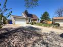 Beautiful single-Gathering home with an attached garage and solar panels on the roof at 4383 S Eagle Cir, Aurora, CO 80015