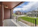 Spacious outdoor balcony area with railing, wood ceiling and views of the neighborhood at 9662 Browns Peak Cir, Littleton, CO 80125