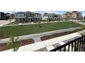 Picture from a balcony overlooking the landscaped street of a home community at 9662 Browns Peak Cir, Littleton, CO 80125