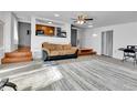 Inviting living room with an open concept design and neutral color palette at 2580 Valley View Dr, Denver, CO 80221