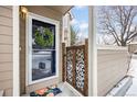 Townhome's front entrance with wreath and decorative gate at 6809 Zenobia St # 4, Westminster, CO 80030