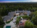Areal view of the house featuring extensive outdoor living spaces and meticulous landscaping at 5 Mockingbird Ln, Cherry Hills Village, CO 80113