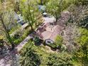 A beautiful aerial view shows the house with mature trees surrounding the property at 1051 Independence St, Lakewood, CO 80215