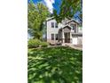 Attractive townhome showcasing a green lawn and cozy outdoor seating area at 4797 Flower St, Wheat Ridge, CO 80033
