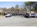 Street view showcasing a row of townhomes with convenient parking spaces at 1811 S Quebec Way # 60, Denver, CO 80231