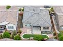 Aerial view showcasing a house with a concrete patio, artificial turf, and a landscaped backyard at 11193 Mission Walk St, Parker, CO 80134