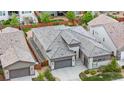 Aerial view of a well-maintained single Gathering house with a brown roof and lush backyard at 11193 Mission Walk St, Parker, CO 80134