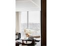 Bright living room seating with floor to ceiling windows at 3100 E Cherry Creek South Dr # 1201, Denver, CO 80209