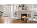 Close-up of brick fireplace with built-in bookshelves and decorative items at 2318 S Lincoln St, Denver, CO 80210